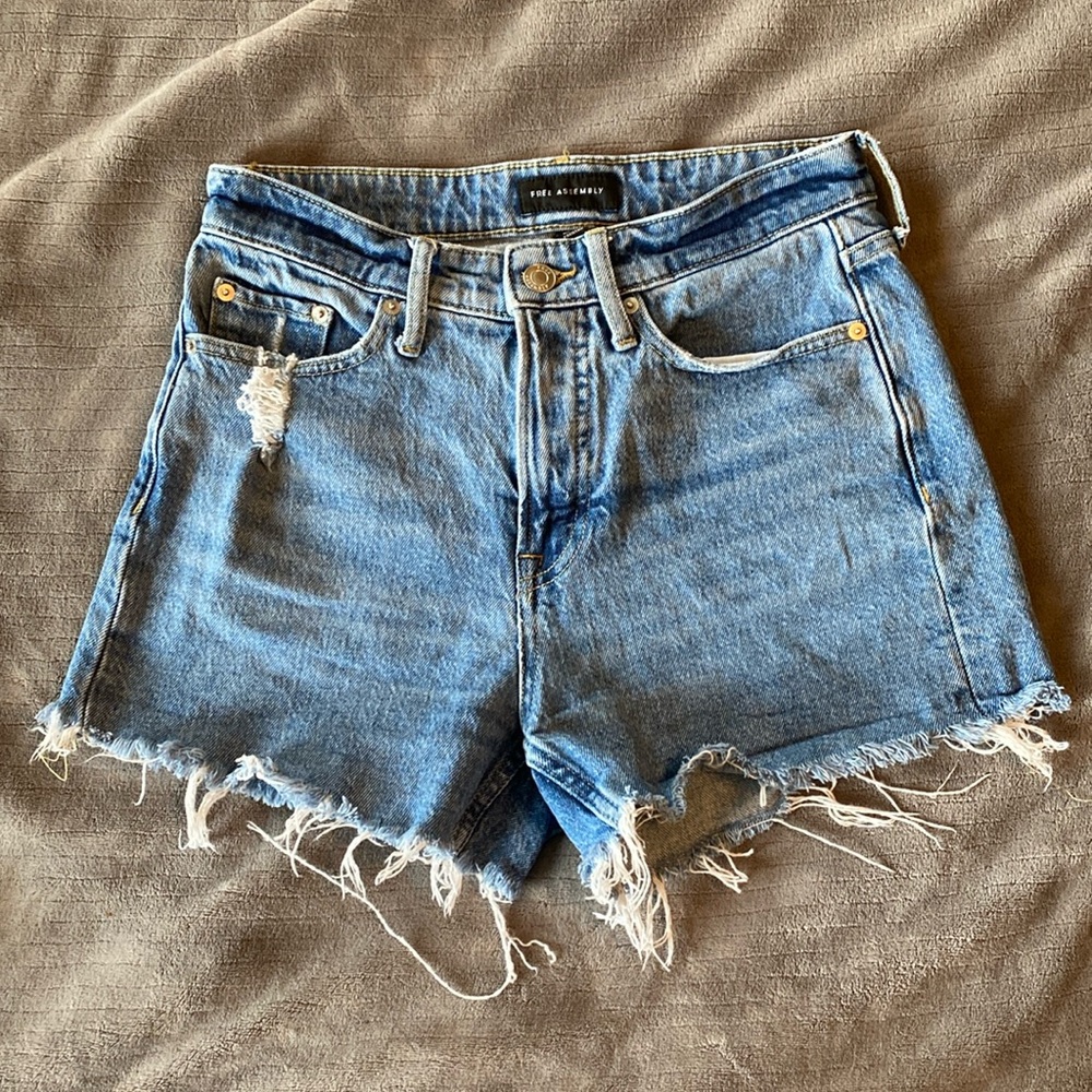 Lightly distressed denim shorts, very flattering with modest coverage
